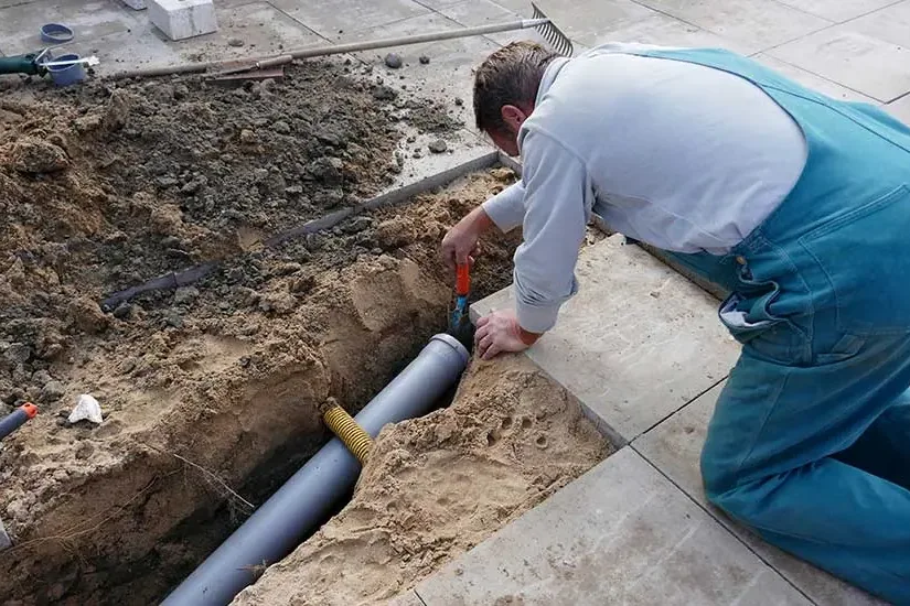 Supply pipe repair at an opened section of a concrete slab floor