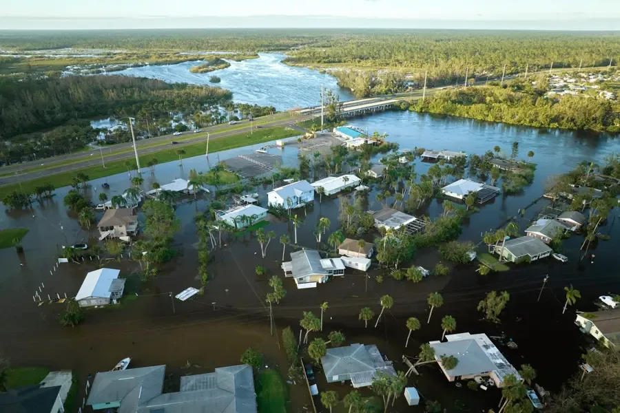 Storm water flooding across a residential street